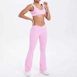 Pink yoga set with U-neck sports bra and crossover high waist flare pants with white piping