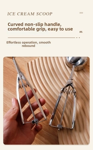 Detail of ergonomic curved non-slip handle on stainless steel ice cream scoop