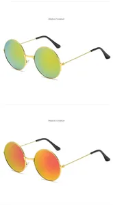 Detail von runden Metall-Sonnenbrillen mit Gold und Rot verspiegelten Gläsern im 45-Grad-Winkel