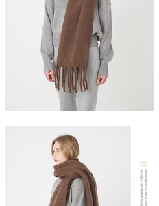 Detailed close-up of dark brown mohair scarf featuring thick tassels and soft knit texture