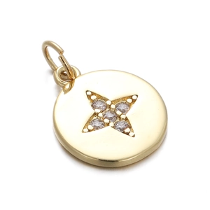 Detailed close-up of a gold-plated starburst pendant with sparkling zircon gemstones
