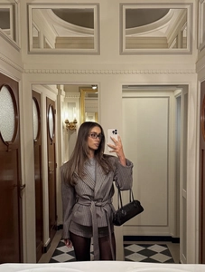 Mirror selfie showing the brown plaid blazer set with waist tie and matching shorts