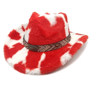 Detail of red and white cow print plush cowboy hat featuring embossed longhorn bull metal buckle
