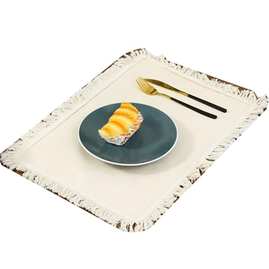 Minimalist beige linen placemat with soft tassels and premium Nordic style table setting