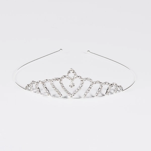 Sparkling silver heart-shaped rhinestone crown tiara for weddings and parties on white background