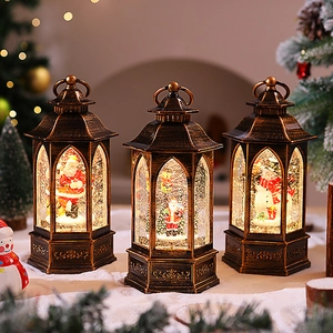 Vintage bronze Christmas lanterns with Santa and snowman scene inside for tabletop decor