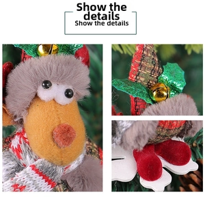 Macro detail of plush Christmas reindeer ornament with bell and sequin leaf accents