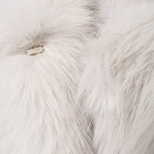 Short faux fur vest in white with round neck and elegant front buckle closure detail