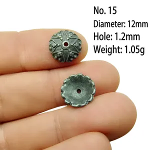 Macro detail of 12mm vintage silver alloy floral bead caps for DIY jewelry making