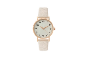 Close-up of minimalist rose gold watch dial with cream leather strap and numeric markers