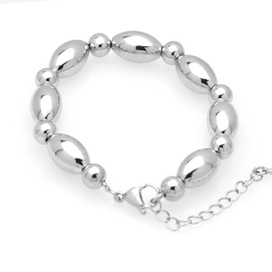 Detail of silver beaded bracelet featuring oval polished beads and lobster clasp closure
