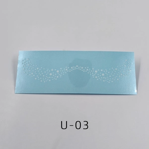 Close-up of waterproof gold freckle tattoo sticker U-03 with blue base and white dots