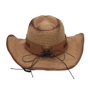 Detail of tan woven straw cowboy hat featuring brown leather band and cross-tie accents