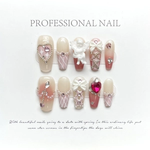 Handmade ballet pink gradient press-on nails with 3D angel charms and pearls
