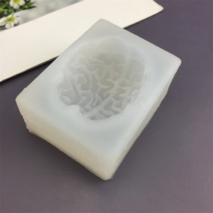 Macro shot of 3D brain shape cavity in translucent white silicone DIY candle mold