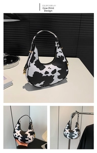 Dettaglio della borsa a mezzaluna con stampa mucca trendy e fibbie in metallo dorato
