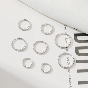 Detailed macro view of S925 sterling silver hoop earrings in various sizes with polished finish