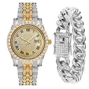 Macro view of diamond-set watch dial and matching cuban link bracelet set in gold silver