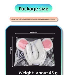 Close-up of plush white mouse ears headband set in retail packaging with size specs