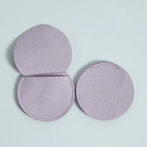 Top view of circular lavender microfiber jewelry pouch with soft velvet texture details