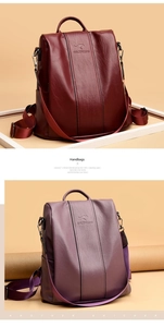 Dettaglio di zaini in pelle PU bordeaux e viola con trama a grana e cerniere in metallo
