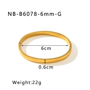 Detailed view of polished gold stainless steel bangle showing 6cm diameter and 0.6cm width