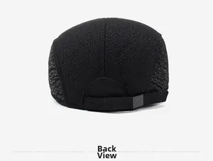Detail view of the adjustable metal buckle with G-M engraving on a wool flat cap