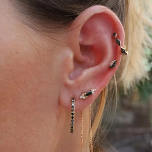 Close-up of S925 silver gold-plated ear cuff set with black and white zircon stones