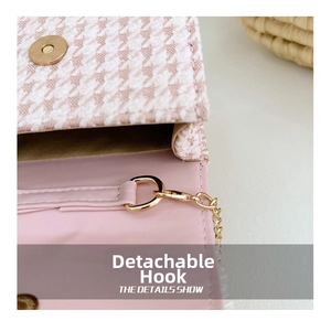 Pink houndstooth mini bag detail with golden magnetic clasp and detachable strap hook