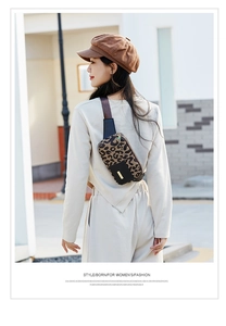 Outdoor street style view of leopard print running waist bag for women with metal zipper