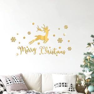 Living room setup featuring gold acrylic mirror reindeer and Merry Christmas wall stickers