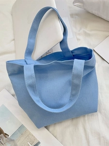 Minimalist light blue canvas tote bag for daily commute and organizing items