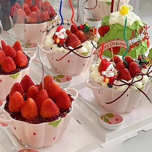 Ceramic strawberry bowl set with Christmas theme decorations and cream dessert