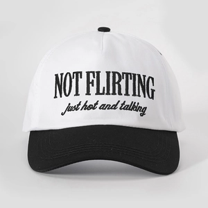 Front view of white and black baseball cap with NOT FLIRTING embroidery detail