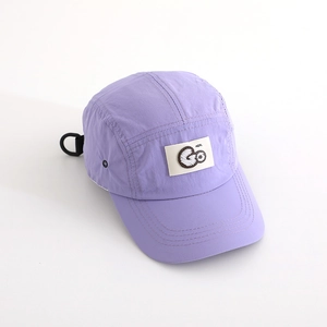 Detailed close-up of lavender quick-dry hat fabric with GO embroidered patch detail