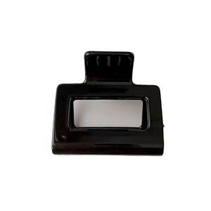 Minimalist black square hollow hair claw clip with glossy finish on white background