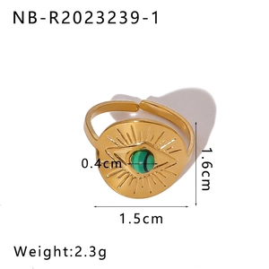 Detailed view of evil eye steel ring with malachite bead and size measurements