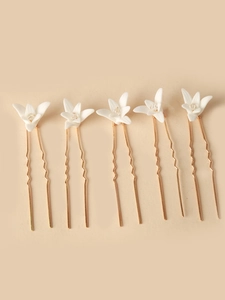 Set of five bridal hair pins with white ceramic flowers and crystal accents on gold U-shaped pins