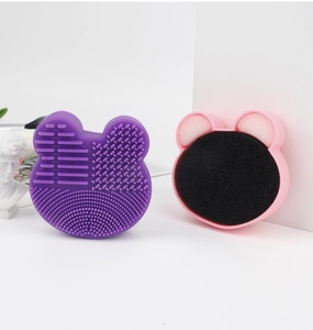 Detail view of purple silicone bear-shaped brush cleaner mat and dry sponge box set