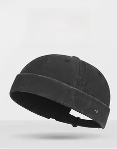 Detail of washed black docker hat with white GOOD DAY embroidery and adjustable strap