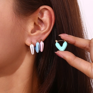 18K gold plated hollow heart earrings in candy colors on model for stylish look
