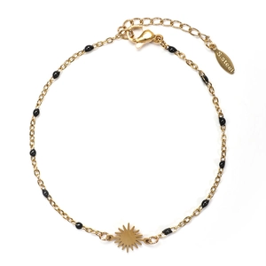 Minimalist gold stainless steel sun pendant bracelet with black beads on a white background