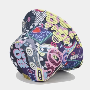 Macro detail of retro 80s graffiti print with vintage cassette tape on bucket hat