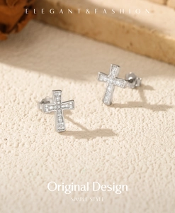 Macro shot of silver S925 cross stud earrings with sparkling pavé moissanite stones