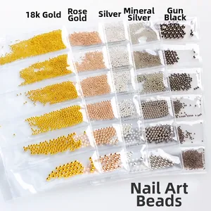 Five colors of metallic nail art beads in 18k gold rose gold silver and black finishes