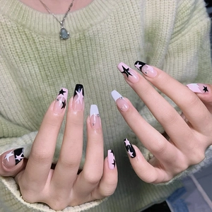Pink and white long coffin press-on nails with black stars and small rhinestones