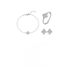 Macro shot of S925 sterling silver clover jewelry set with shimmering moissanite