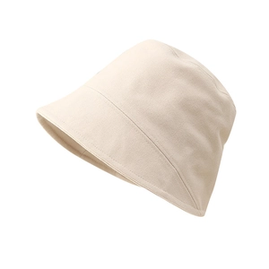 Minimalist beige canvas bucket hat for women with a stylish wide brim and clean stitching