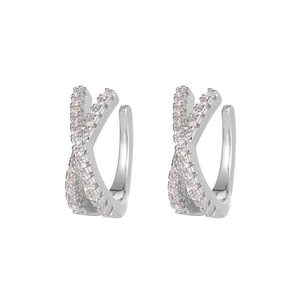 Detailed macro view of silver cross earrings featuring micro-pave sparkling cubic zirconia