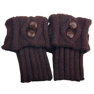 Close-up of dark brown knit leg warmers featuring diamond pattern and dual vintage buttons